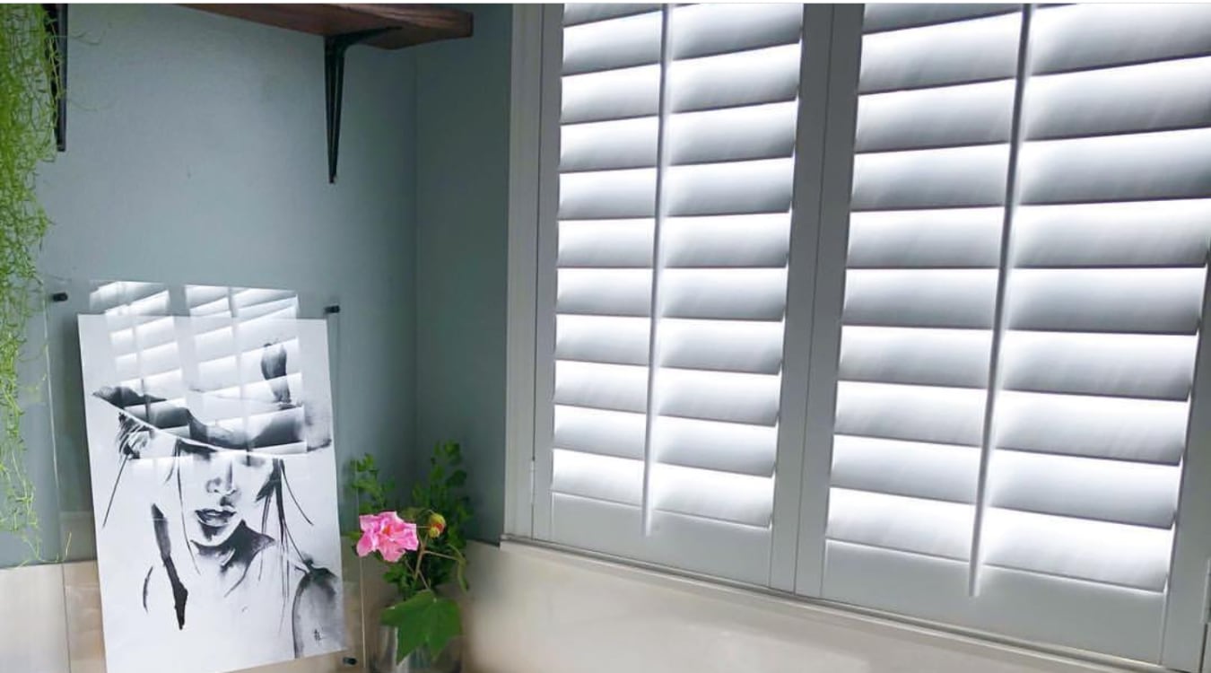 Polywood shutters over a window.